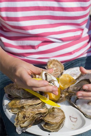 people eating seafood - Woman eating oysters in Cancale, Close Up Stock Photo - Rights-Managed, Code: 832-03724643