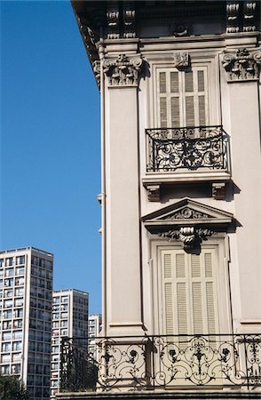 Traditional shuttered window and modern tower blocks Stock Photo - Rights-Managed, Code: 832-03724731