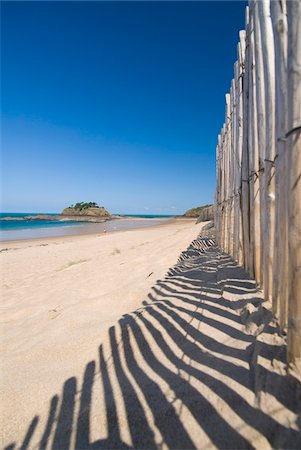 Looking along fence beside beach to the Fort du Guesclin, Low Angle View Stock Photo - Rights-Managed, Code: 832-03724881