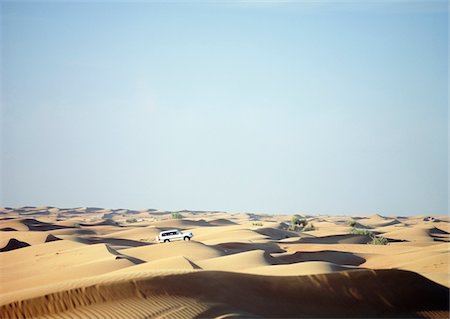 drive jeep country - Jeep driving across dunes at dusk near Dubai Stock Photo - Rights-Managed, Code: 832-03724908