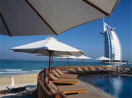 dubai beaches - Modern building viewed from under umbrella Stock Photo - Rights-Managed, Code: 832-03724989