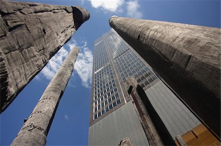Low angle view of sculptures and skyscrapers Stock Photo - Rights-Managed, Code: 832-03723663