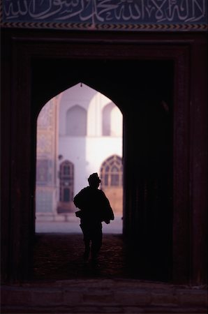 Boy silouhetted against the opening of Mosque Stock Photo - Rights-Managed, Code: 832-03723692