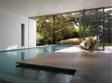 seating at the pool - Interior/exterior swimming pool. Ad Astra. Architects: Munkenbeck and Marshall Stock Photo - Rights-Managed, Code: 845-05837634