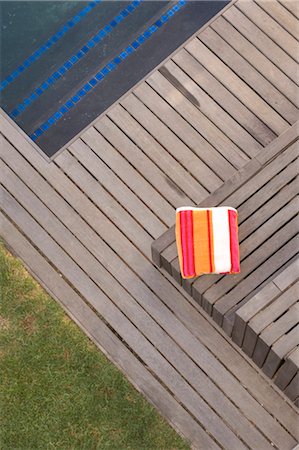 folded towels - Elevated view of folded towel on decking. Stock Photo - Rights-Managed, Code: 845-05837788