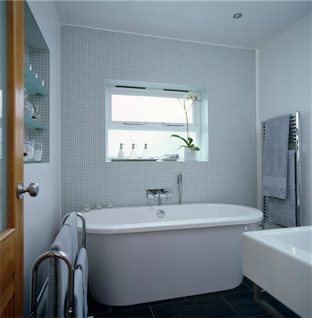 simsearch:693-03474268,k - Freestanding bathtub beneath window in contemporary bathroom Stock Photo - Rights-Managed, Code: 845-05838832