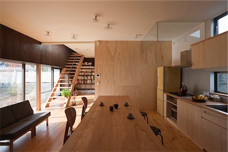 Matsugasaki-So, Apartment House, Openplan kitchen and dining room with large sliding door to living room. Architects: Dai Nagasaka, Mega Stock Photo - Rights-Managed, Code: 845-05839534