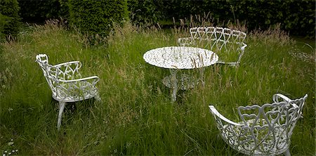 spooky chairs - Water feature in Lincolnshire garden, UK. Stock Photo - Rights-Managed, Code: 845-06007954