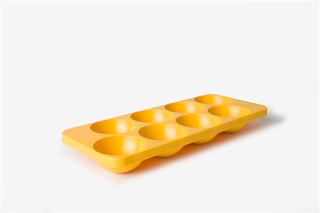 plastic utensil - Yellow Moulded Plastic Ice Cube Tray Stock Photo - Rights-Managed, Code: 845-06008251
