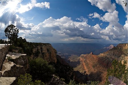 Grand Canyon, Arizona, with the sun breaking though a dramatic cloudy sky. Stock Photo - Rights-Managed, Code: 845-07561404