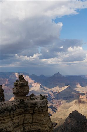 A distinctive zuegen rock formation, against the background of the Grand Canyon, Arizona, as a storm develops. Stock Photo - Rights-Managed, Code: 845-07561405