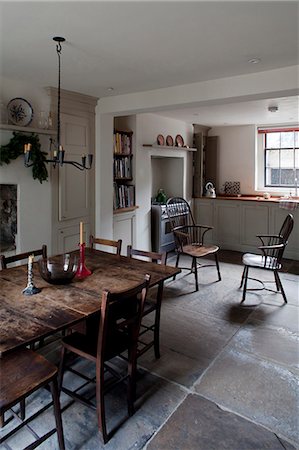 Basement kitchen with dining table and chairs, Whitechapel, London Stock Photo - Rights-Managed, Code: 845-07561436