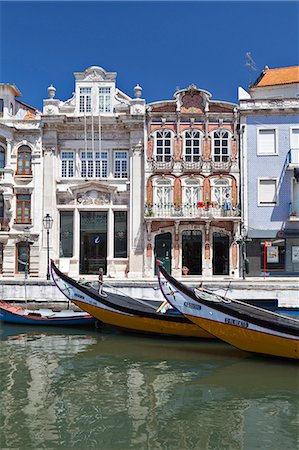 Art Nouveau buildings and the prows of traditional moliceiros boats moored on the canal at Aveiro, Portugal Stock Photo - Rights-Managed, Code: 845-07584912