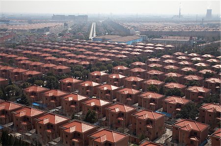 simsearch:845-06008378,k - View of private villas, factories, apartment blocks, working farmland and construction sites in Huaxi Village, Jiangsu, Chinas most densely populated province Since 2006, Jiangsu has been Chinas largest recipient of direct foreign investment. Foto de stock - Direito Controlado, Número: 845-07584930
