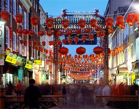 CHINATOWN, Gerrard Street, London. General view of china town at dusk showing the busy street with red lanterns and entrance gateway. Stock Photo - Rights-Managed, Code: 845-08939637