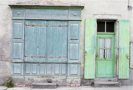 front entrance wooden doors - shuttered shop, soft blue, with door and window shutters light green. traditional paint colours, faded, patina. Laguepie. Stock Photo - Rights-Managed, Code: 845-02729337