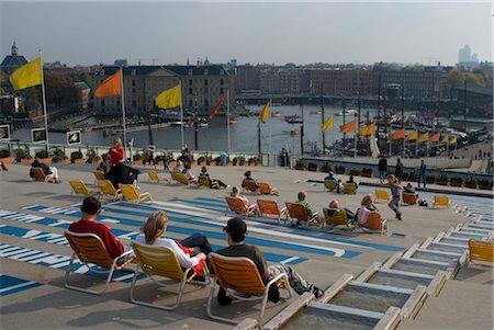 Sunbathing on the roof of NEMO, Eastern Docks, Amsterdam. Stock Photo - Rights-Managed, Code: 845-03463733