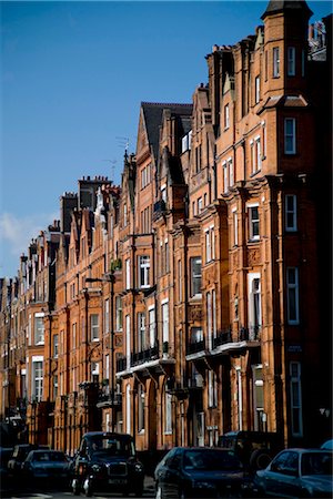 rows houses street - Cadogan's Chelsea Estate has its origins in the historic Manor of Chelsea, which dates from Anglo-Saxon times. Stock Photo - Rights-Managed, Code: 845-03552671