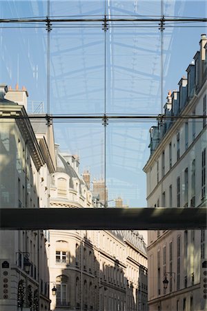 Traditional Paris apartment buildings and reflection of modern glass roof in Paris, France. Looking down Passage des Jacobins and out into rue du Marche Saint-Honore. Stock Photo - Rights-Managed, Code: 845-03552714