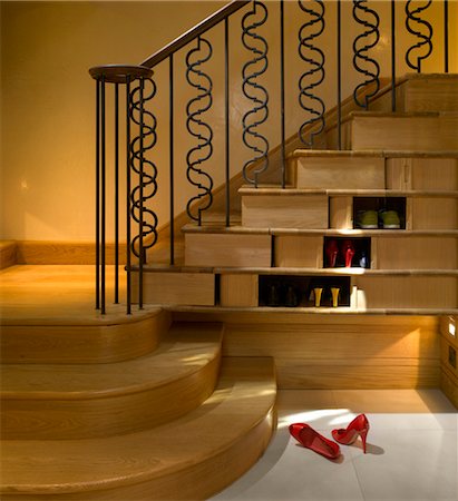 stairs inside house - House in Chelsea, London with eleant understairs shoe shelves. Architects: Chris Dyson Architects Stock Photo - Rights-Managed, Code: 845-03720705