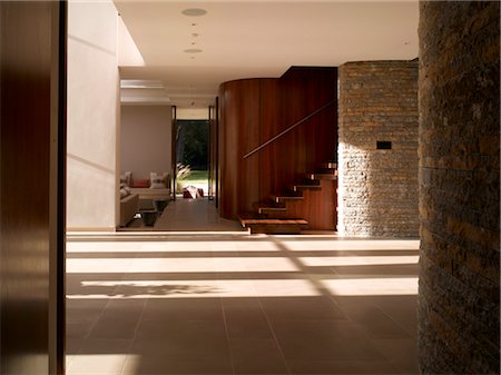 simsearch:845-03777225,k - Ad Astra. Spacious main entrance hall with curved stone walls. Architects: Munkenbeck and Marshall Stock Photo - Rights-Managed, Code: 845-03777229