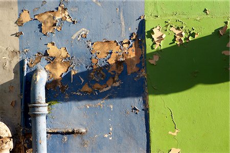 Grenada. Detail of dilapidated blue and green painted wall with pipe. Stock Photo - Rights-Managed, Code: 845-03777404
