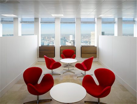 round table - Red Arne Jacobsen swan chairs set around tables, City Tower, Manchester, Greater Manchester. Architects: Stephenson Bell Architects Stock Photo - Rights-Managed, Code: 845-03777483