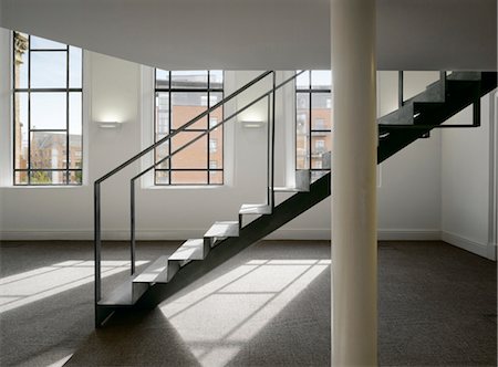 pillar and stairs - Staircase in an open plan office space in a refurbished chapel. Architects: OMI Architects Stock Photo - Rights-Managed, Code: 845-03777615