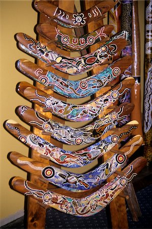 simsearch:846-05645836,k - 1990s CAIRNS, AUSTRALIA 9 BOOMERANGS DECORATED WITH ABORIGINE HAND PAINTED DESIGNS Stock Photo - Rights-Managed, Code: 846-05645821