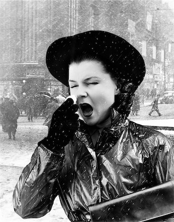 simsearch:846-05645866,k - 1940s WOMAN SNEEZING WEARING RAINCOAT CITY STREET SCENE BACKGROUND Stock Photo - Rights-Managed, Code: 846-05645873