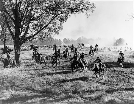 ARMY REGIMENT CAVALRY COMING TO RESCUE OR BEING CHASED BY UNIFORMED TROOPS MOVIE STILL Stock Photo - Rights-Managed, Code: 846-05645921