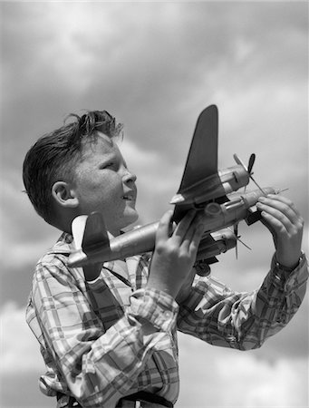 simsearch:846-05647759,k - 1930s - 1940s - 1950s PROFILE FRECKLE-FACED BOY HOLDING MODEL PROPELLER AIRPLANE Stock Photo - Rights-Managed, Code: 846-05645946