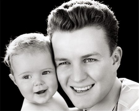 simsearch:846-06112032,k - 1940s PORTRAIT OF SMILING FATHER HOLDING BABY DAUGHTER TO CHEEK Foto de stock - Con derechos protegidos, Código: 846-05645947