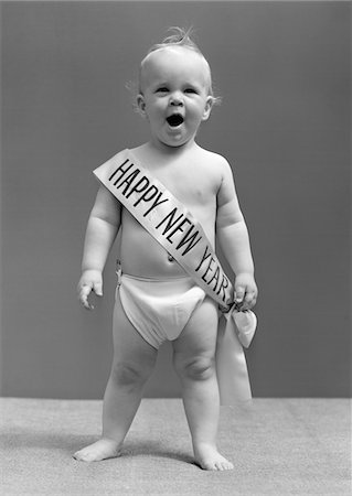 funny new years eve pics - 1940s BABY STANDING IN DIAPER YAWNING WEARING HAPPY NEW YEAR SASH Stock Photo - Rights-Managed, Code: 846-05645976