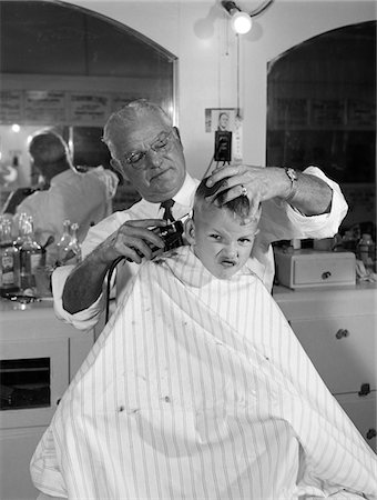 sad boy in black and white - 1950s BOY IN BARBERSHOP GETTING HIS HAIR CUT Stock Photo - Rights-Managed, Code: 846-05646184