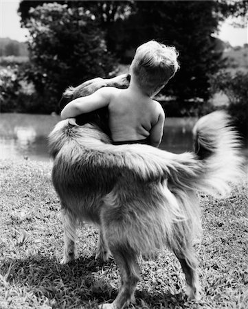 simsearch:846-05646255,k - 1940s - 1950s - 1960s BACK VIEW OF BOY AND DOG HUGGING Stock Photo - Rights-Managed, Code: 846-05646255