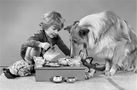 simsearch:846-09012877,k - 1950s - 1960s LITTLE GIRL POURING MILK AT TEA PARTY FOR COLLIE DOG Stock Photo - Rights-Managed, Code: 846-05646280