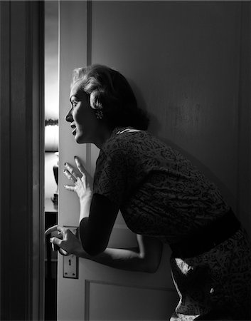 dark corridor - 1950s WOMAN PEEKING THROUGH OPEN DOOR Stock Photo - Rights-Managed, Code: 846-05646375