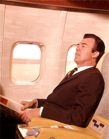 retro business man - 1960s MAN SITTING IN FIRST CLASS AIRPLANE PASSENGER SEAT Stock Photo - Rights-Managed, Code: 846-05646591