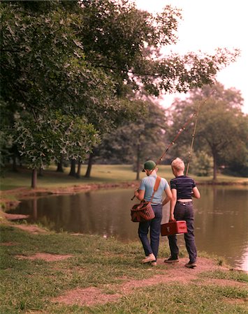 friend (male) - 1970s TWO BOYS WALKING BESIDE POND CARRYING FISHING POLES AND TACKLE Stock Photo - Rights-Managed, Code: 846-05646593