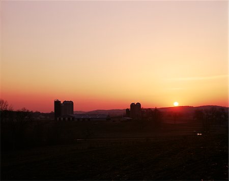 GOLDEN SUNSET SUNRISE OVER FARMLAND SCENIC LANDSCAPE SILOS SILHOUETTED CHESTER COUNTY PENNSYLVANIA USA Stock Photo - Rights-Managed, Code: 846-05646840
