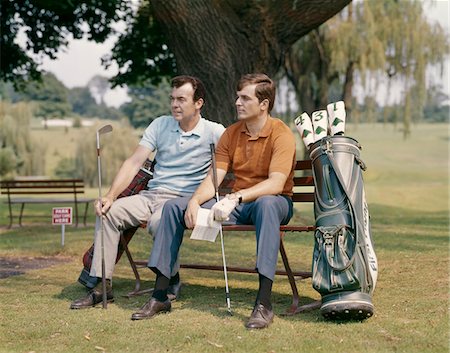 1960s TWO MEN SITTING UNDER TREE WAITING TO TEE-OFF Stock Photo - Rights-Managed, Code: 846-05646964