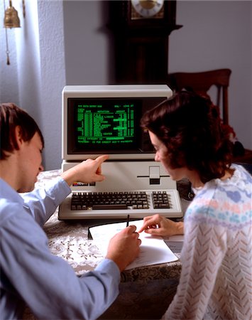 simsearch:846-02796424,k - 1980s TEENAGE COUPLE BOY AND GIRL WORKING TOGETHER ON APPLE III PERSONAL COMPUTER Stock Photo - Rights-Managed, Code: 846-05647037