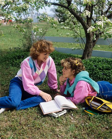 denims fashion - 1980s TWO TEENAGE GIRLS UNDER BLOSSOMING TREE READING STUDYING TALKING Stock Photo - Rights-Managed, Code: 846-05647074