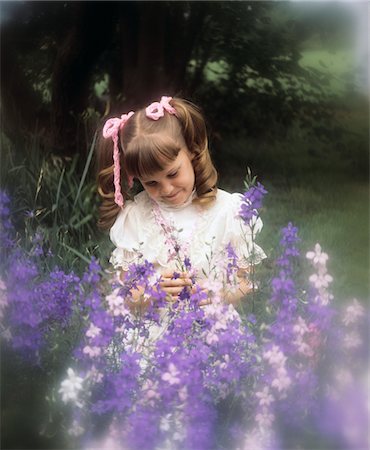 photography of little girl dreaming - 1970s LITTLE GIRL PIGTAILS PINK RIBBONS WITH PURPLE FLOWERS Stock Photo - Rights-Managed, Code: 846-05647076