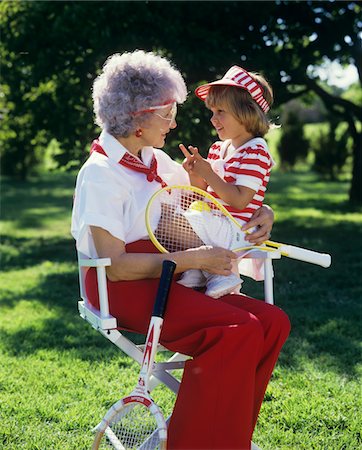 1980s GRANDMOTHER AND GIRL IN RED WHITE TENNIS OUTFITS Stock Photo - Rights-Managed, Code: 846-05647093