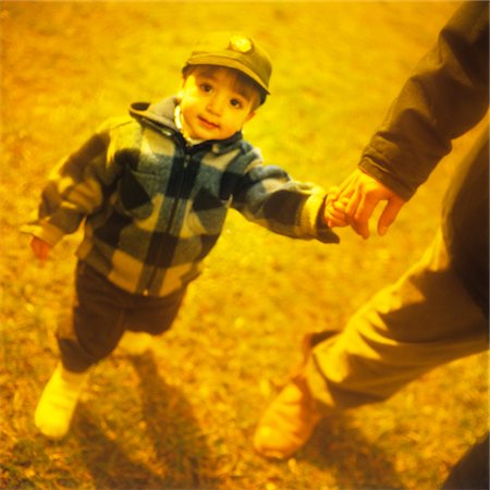 BOY HOLDING ADULTS HAND Stock Photo - Rights-Managed, Code: 846-05647115
