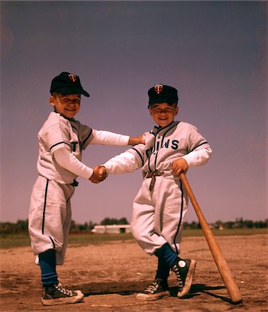 simsearch:846-05646069,k - 1960s TWO BOYS PLAYING LITTLE LEAGUE BASEBALL SHAKING HANDS Stock Photo - Rights-Managed, Code: 846-05647120