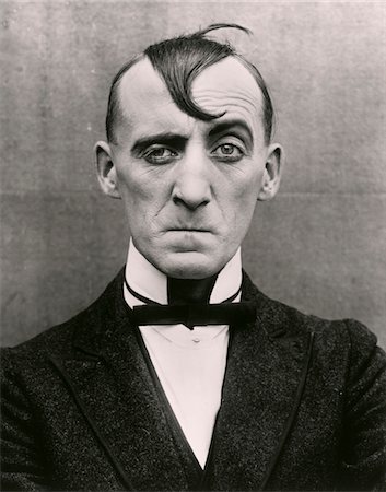 facial expression - 1910s - 1920s MAN CHARACTER SOUR PUSS MOVIE ACTOR Foto de stock - Con derechos protegidos, Código: 846-05647182