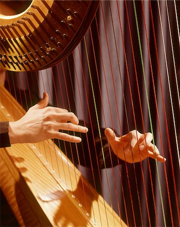 retro musician - 1960s MUSICAL INSTRUMENT DETAIL HANDS PLUCKING PLAYING HARP STRINGS Stock Photo - Rights-Managed, Code: 846-05647248